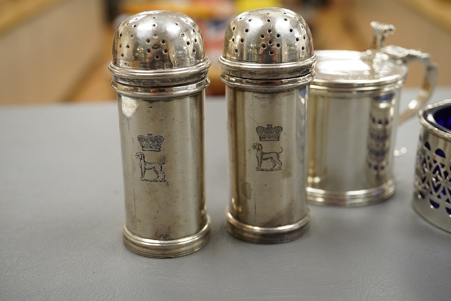 Five assorted silver condiments including a mustard pot and a pair of pepperettes, Birmingham, 1935, 79mm. Condition - fair
